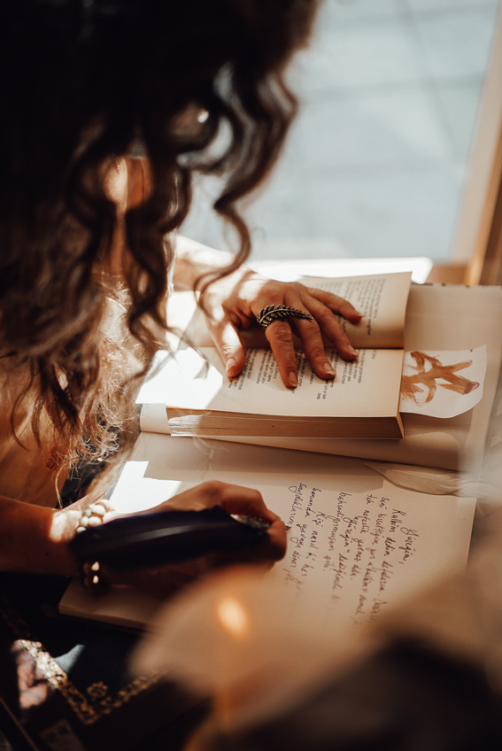 Faceless woman writing using ink